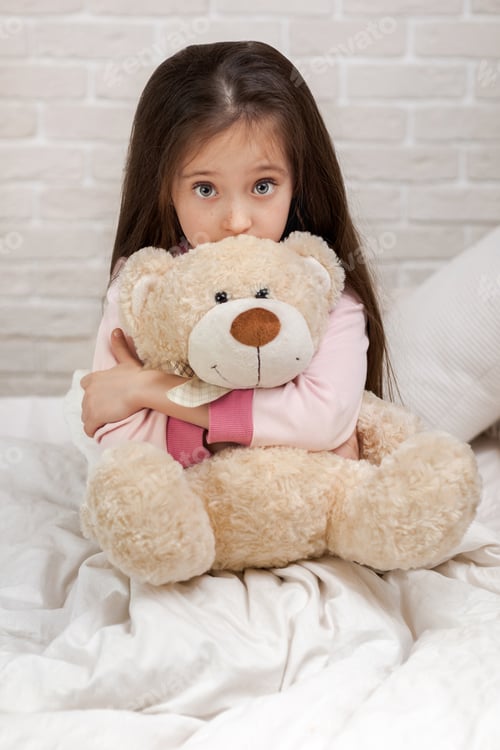 Preview: baby hugging a teddy bear