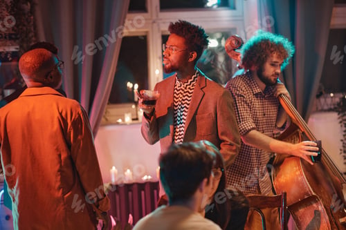 Preview: African man at social event