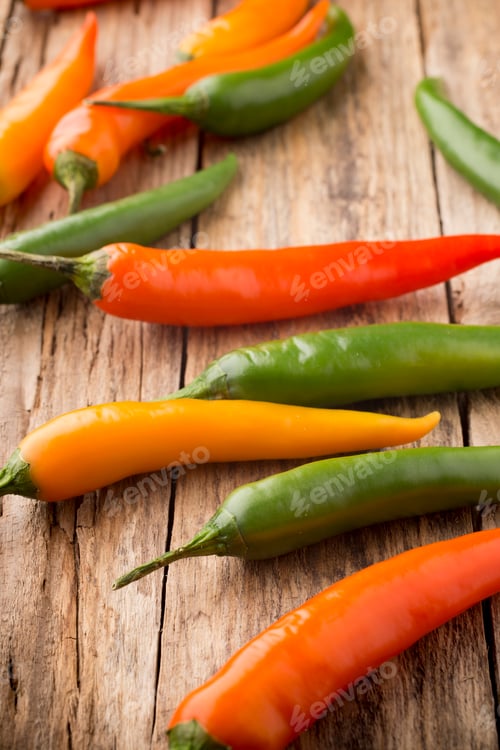 Preview: Chili pepper mix on a wooden background.