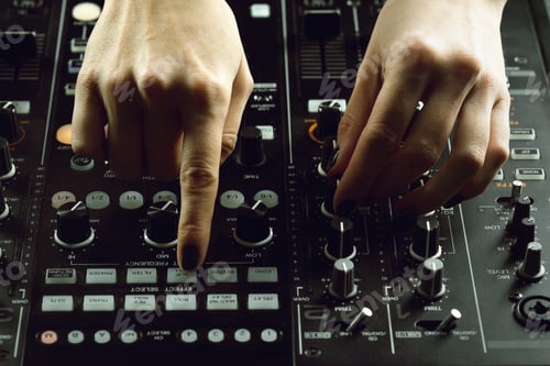 Preview: DJ playing music at mixer closeup