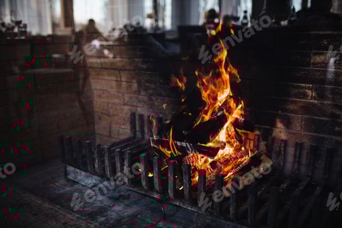 Preview: Burning woods with bright flame and sparks against dark background. Bright flame