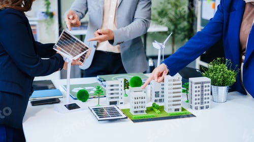 Preview: Trio of businesspeople, including a middle-aged Asian man and woman, strategize at their desk