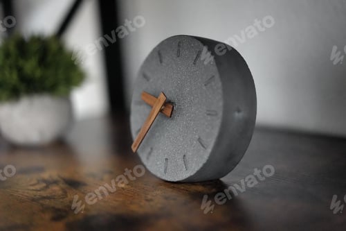 Preview: Closeup of a modern desk watch with a unique design