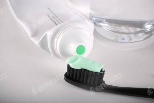 Preview: Black Toothbrush Lying On White Background