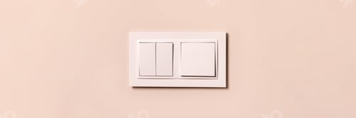 Preview: White electrical switches on beige wall banner, header