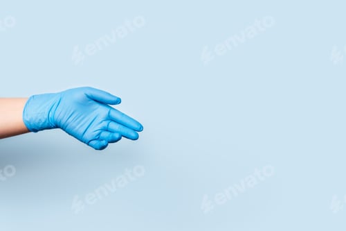 Preview: Protective Blue Glove Against Pale Blue Background