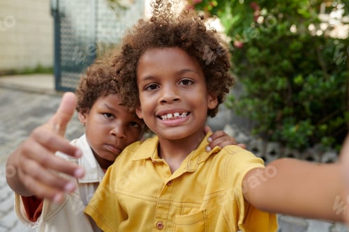 Preview: Boy Taking Selfie with Brother