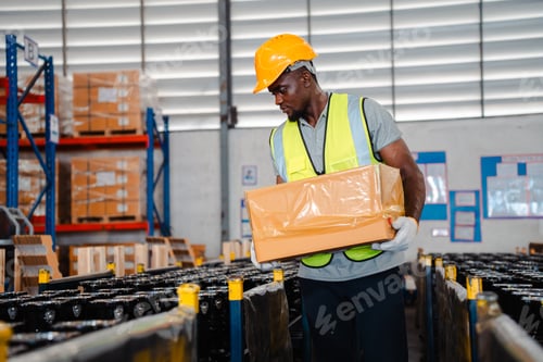 Preview: African American person working to shipping box package by order in logistic warehouse