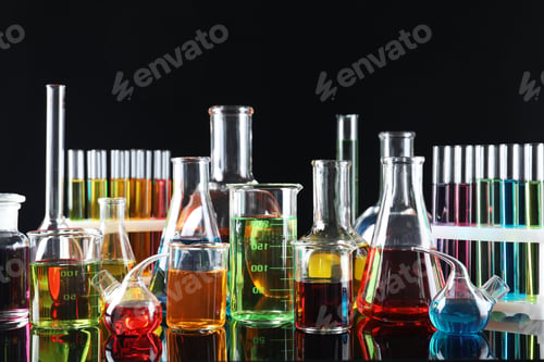 Preview: Laboratory glassware with colorful liquids on black background