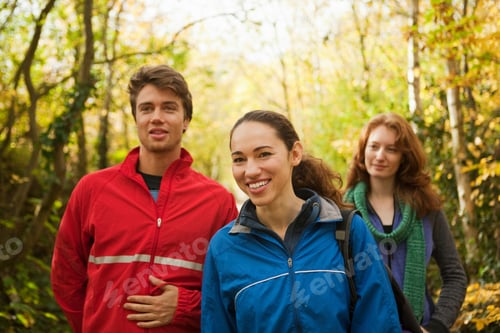 Preview: Friends enjoying a colorful autumn hike in the woods