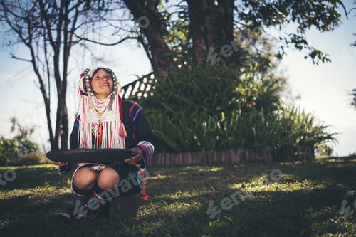 Preview: Akha in the north of Thailand enjoying coffee from shell by bamboo basket with traditional cloth.