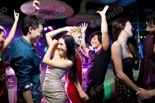 Preview: Stylish young people dancing in nightclub