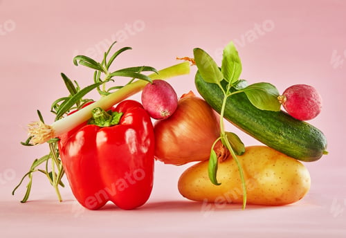 Preview: A gourmet food composition with colorful vegetables on a pink background