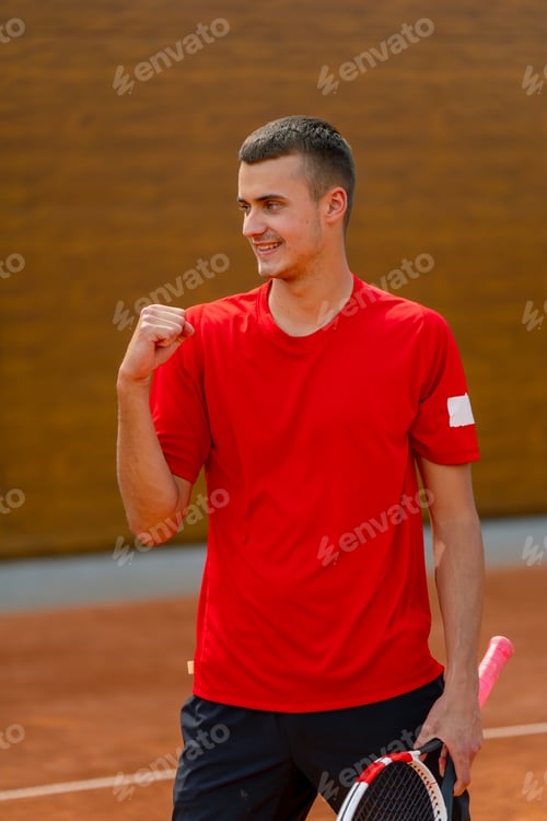 Preview: portrait of a young professional tennis player rejoices at the victory at the tournament competition