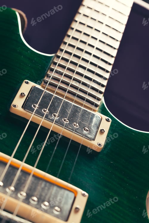 Preview: Electric guitar body and neck detail on wooden background