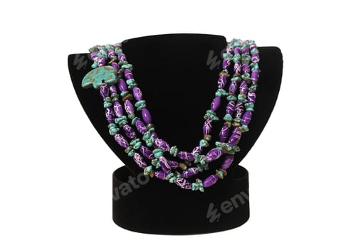 Preview: Closeup of turquoise beaded necklace on a black bust on a white background