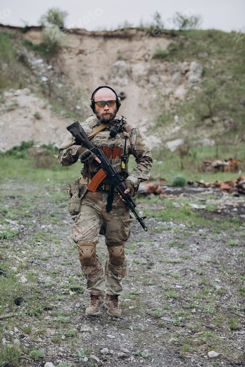 Preview: Portrait of Ukrainian soldier holding rifle