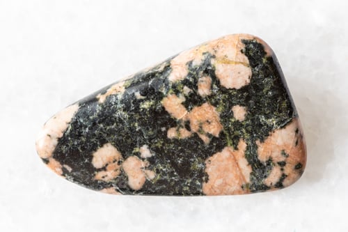 Preview: sample of polished gabbro mineral on white marble