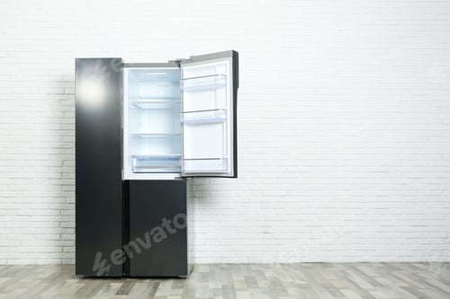 Preview: Modern empty refrigerator near white brick wall, space for text