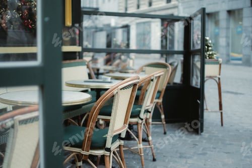 Preview: a table with chairs set up at a patio for dining