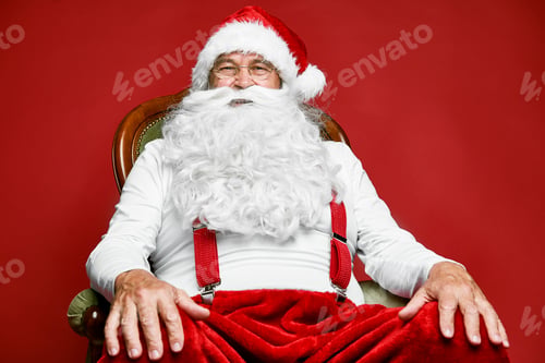 Preview: Portrait of caucasian Santa Claus sitting on the retro chair