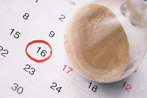 Preview: hourglass on a calendar, and flowing through the bulb of sandglass