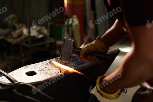 Preview: Blacksmith shaping heated metal bar