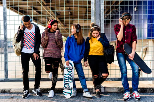 Preview: Group of school friends outdoors lifestyle and leisure music concept