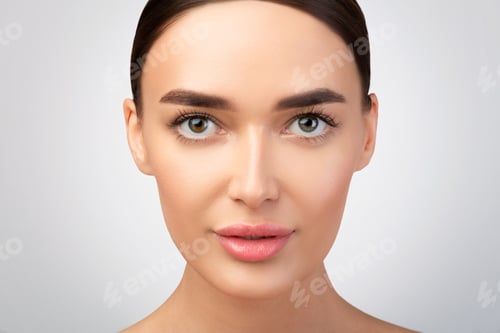 Preview: Portrait Of European Woman Looking At Camera On Gray Background