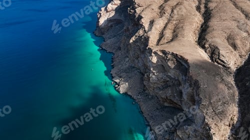 Preview: Stunning view of Shoab bay in Socotra showcasing clear blue waters and rugged cliffs