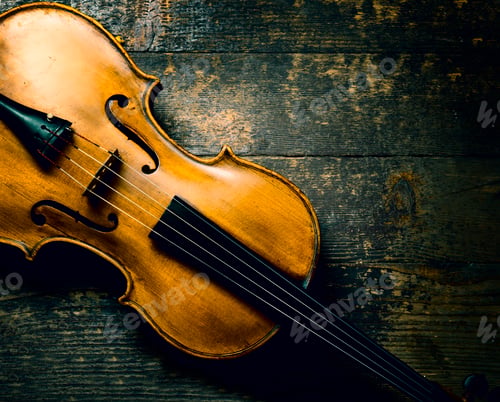 Preview: Violin on rustic wooden background from above.