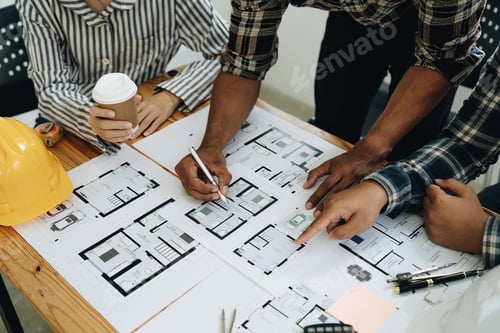 Preview: Architect and engineer team working with blueprints for architectural plan, engineer sketching a