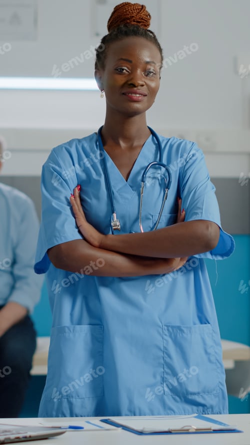 Preview: Portrait of medical assistant wearing uniform standing in cabinet
