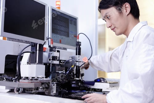 Preview: Technician working in LED factory