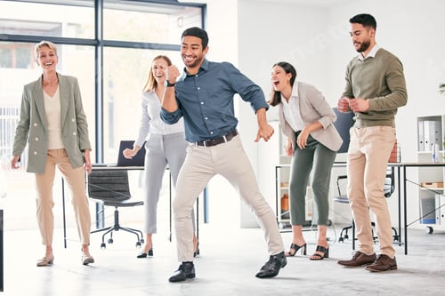 Preview: Full length shot of a diverse group of businesspeople standing together and dancing in the office