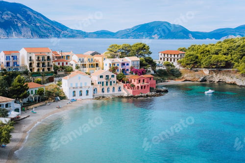 Preview: Cute blue sea bay in front of Assos village. Beautiful view to vivid colorful houses near blue