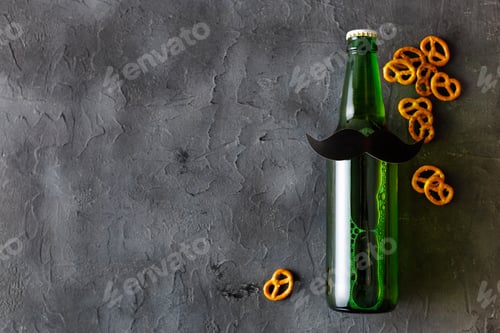 Preview: Bottle of beer with moustache. Movember. Concept of father's day, bachelor party.