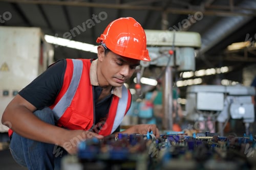 Preview: Factory Engineer Operating machines in industry factory.