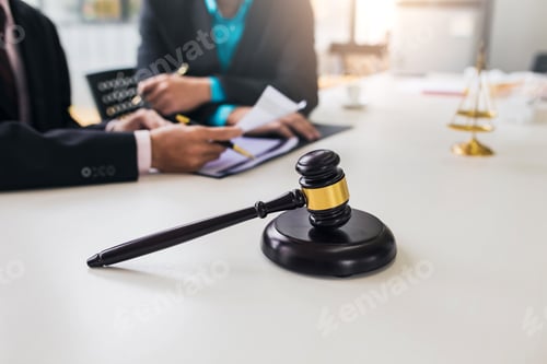Preview: Team of lawyers man working together on legal matters in the office.