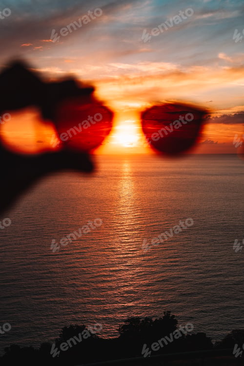Ocean Sunset Seen Through Red-Tinted Sunglasses