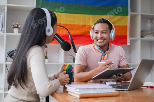 Preview: A young gay man and his girlfriend use a laptop and microphone to stream podcast audio at a studio