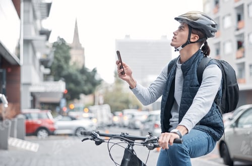 Preview: Travel, bike driver or man with phone in London city, street or road for GPS, location or networkin