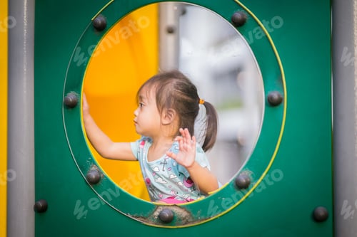 Preview: toddler girl from the playground window