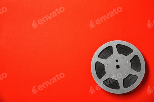 Preview: Movie reel on color background, top view with space for text. Cinema production