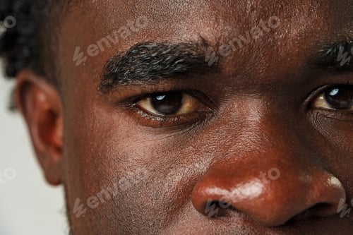 Preview: Close Up of African Mans Face With Brown Eyes