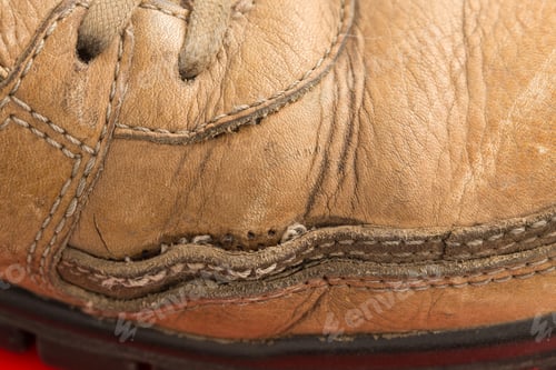 Preview: Closeup of old leather boot.