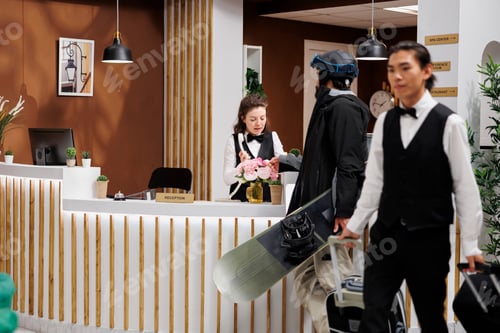 Preview: Receptionist assists man with hotel room