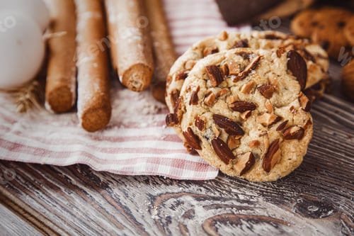 Preview: Delicious Almond Cookies and Breadsticks on Wooden Table