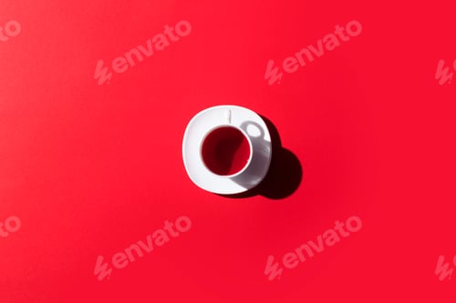 Preview: top view of cup of herbal tea isolated on red