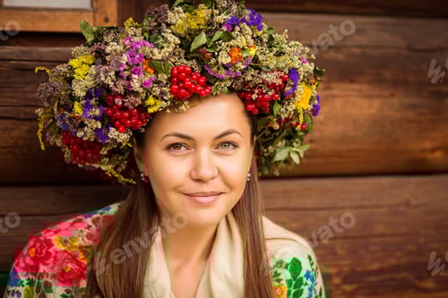Preview: Woman with Flower Crown in Front of Wooden Wall